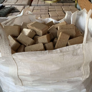 A bulk bag filled with loose BioBurn firebricks